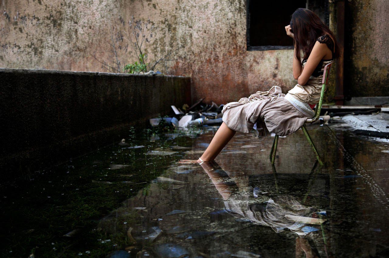 lonely girl sitting alone heart broken and upset after love failure