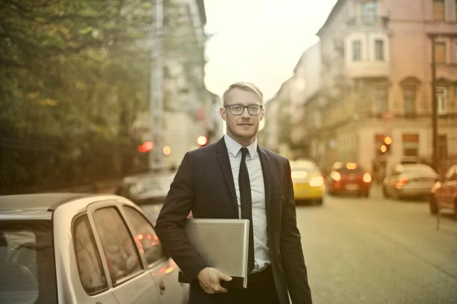 man holding a laptop