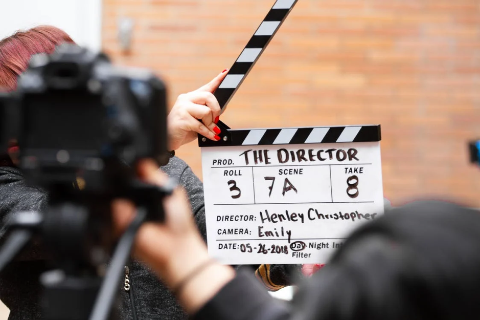 Man holding a clapperboard board