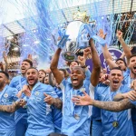 Manchester-City-Football-Club-team-celebrates-with-Premier-League-trophy-championship