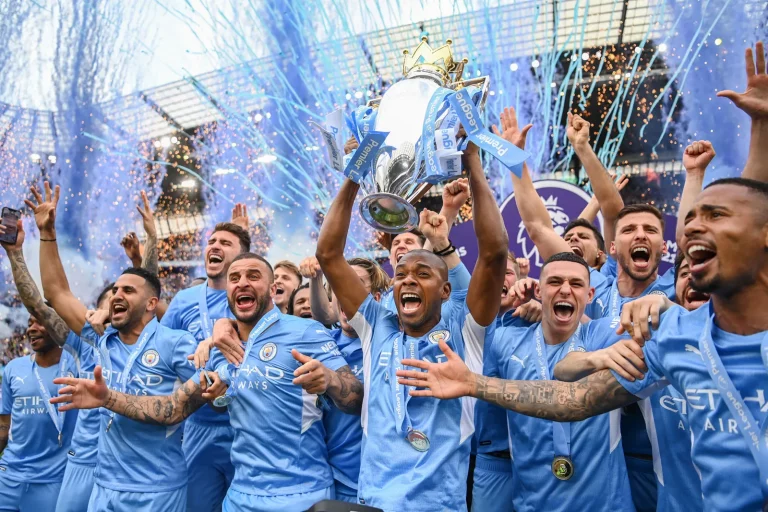 Manchester-City-Football-Club-team-celebrates-with-Premier-League-trophy-championship