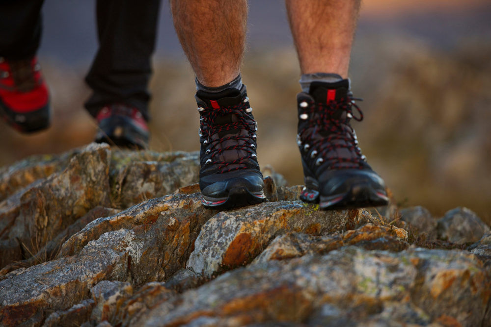 Close up of hiking boots on mountainside