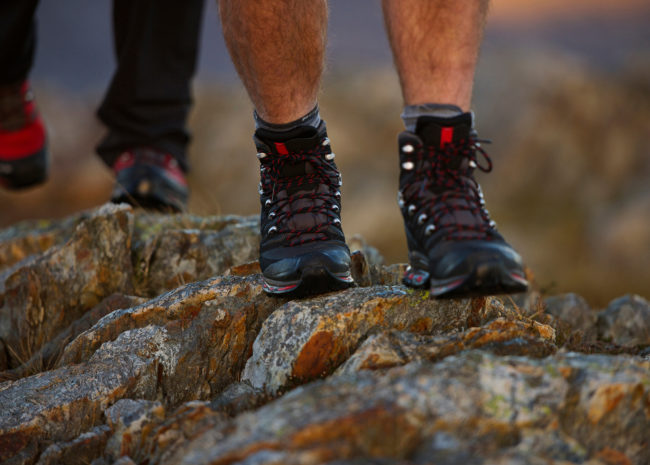 Close up of hiking boots on mountainside