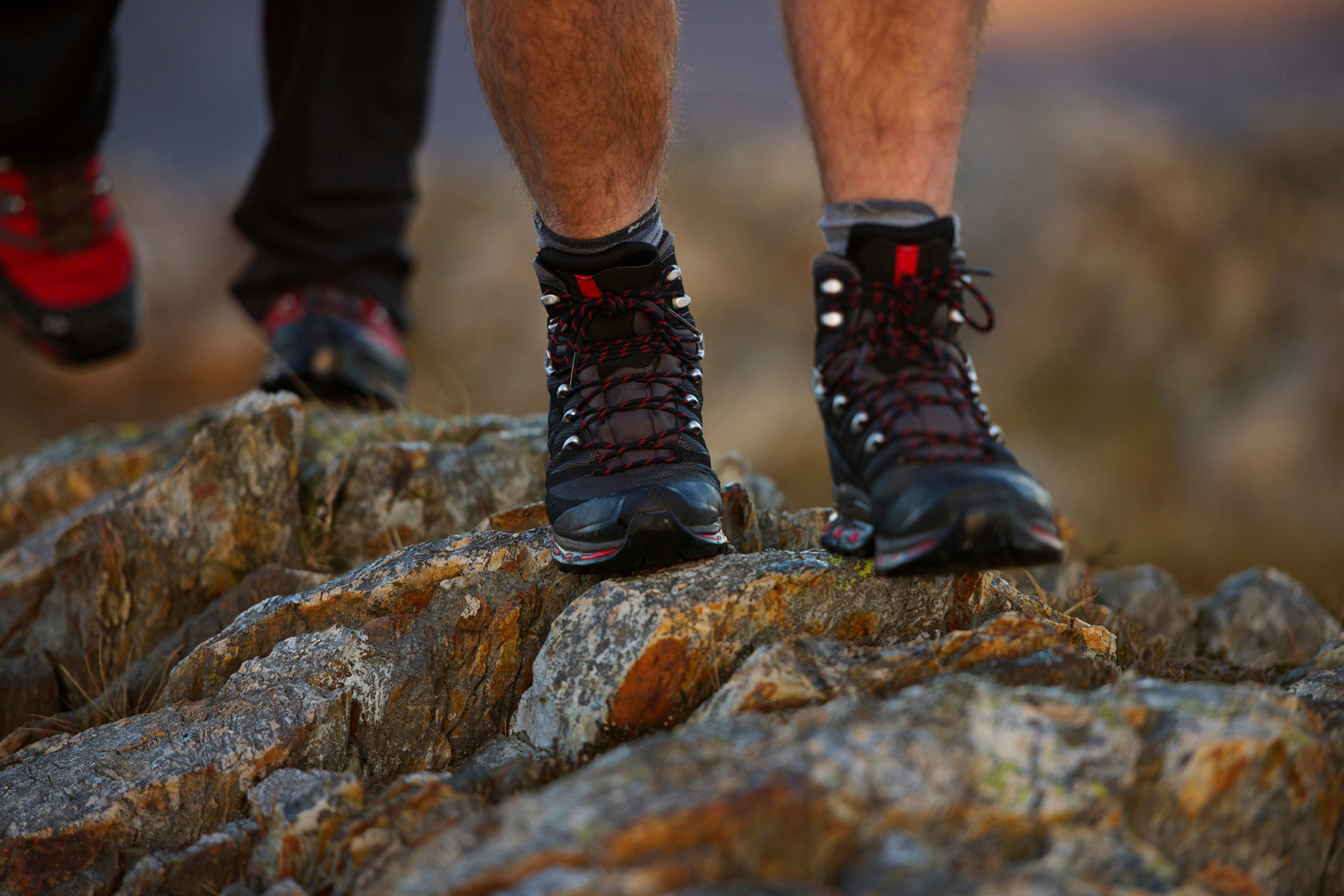 Close up of hiking boots on mountainside